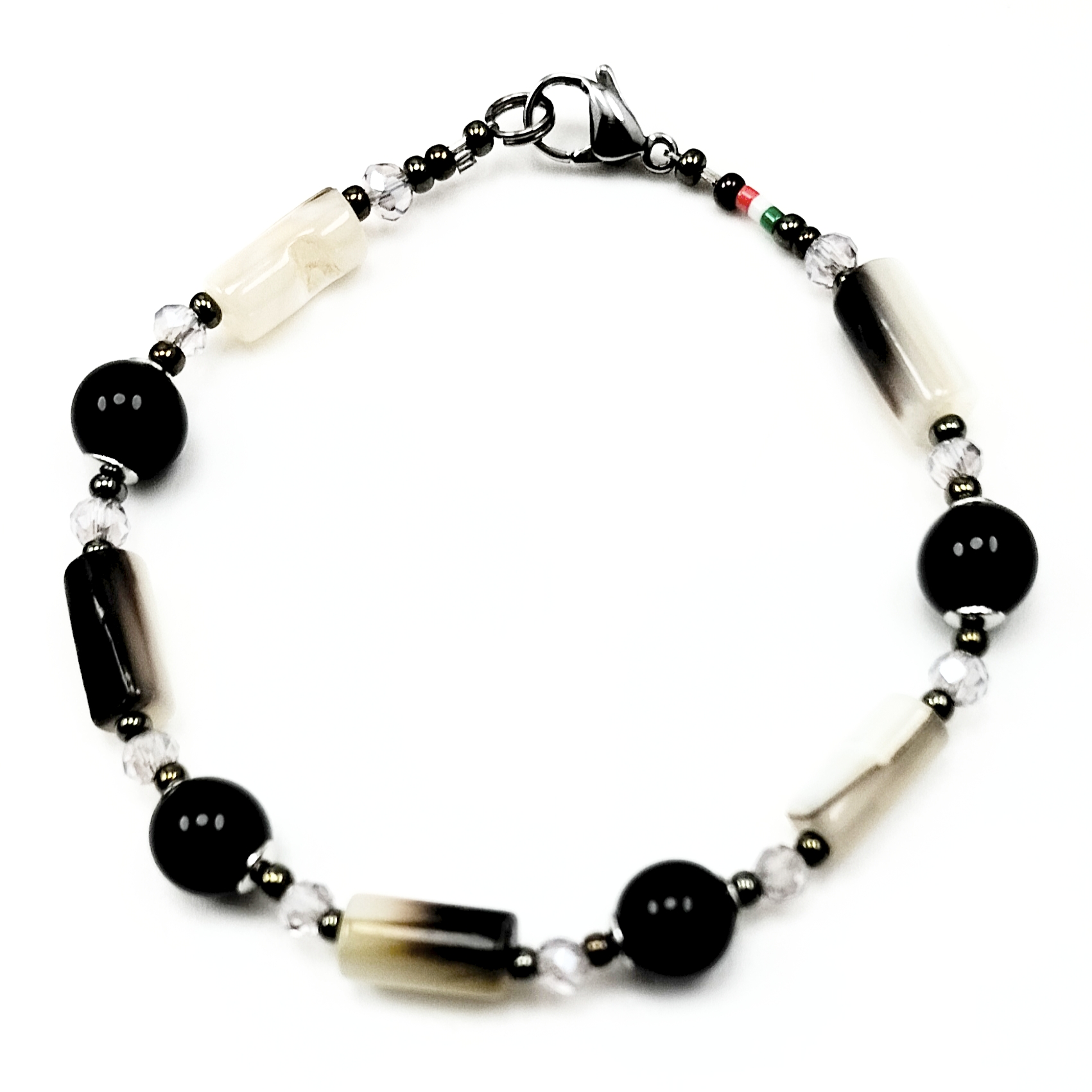 BRACCIALE TUBETTI MADREPERLA LAVA RODIATA BRACCIALE TUBETTI MADREPERLA LAVA RODIATA